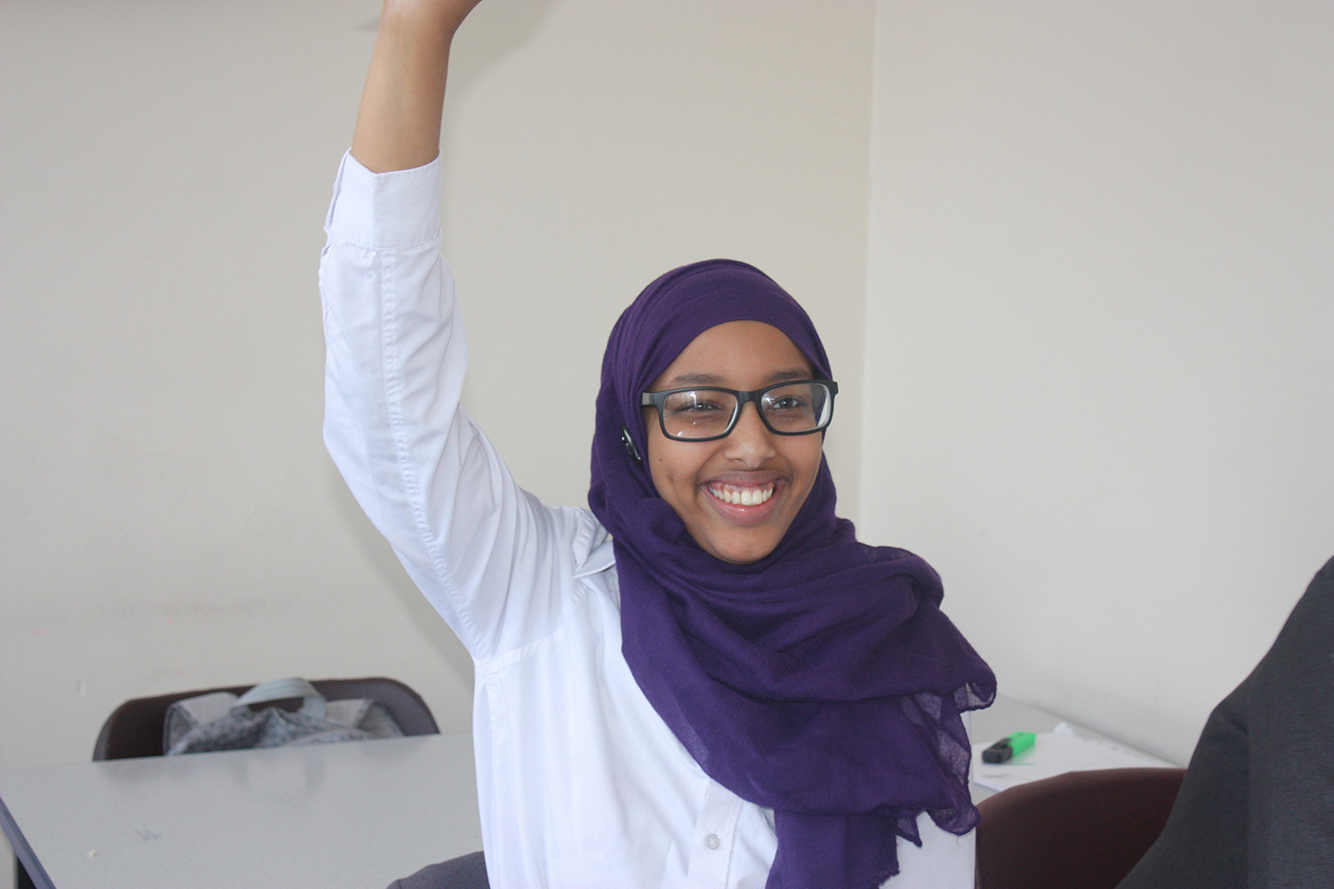 one student hand up one student hand up